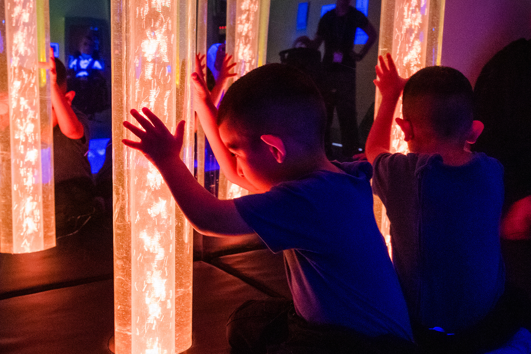 Photograph of Thomas Wolsey pupils in a sensory room with light columns