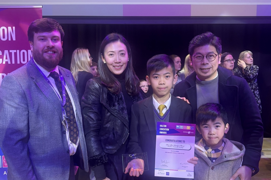 Photo of parents and pupil with prize from Ormiston Chadwick Academy