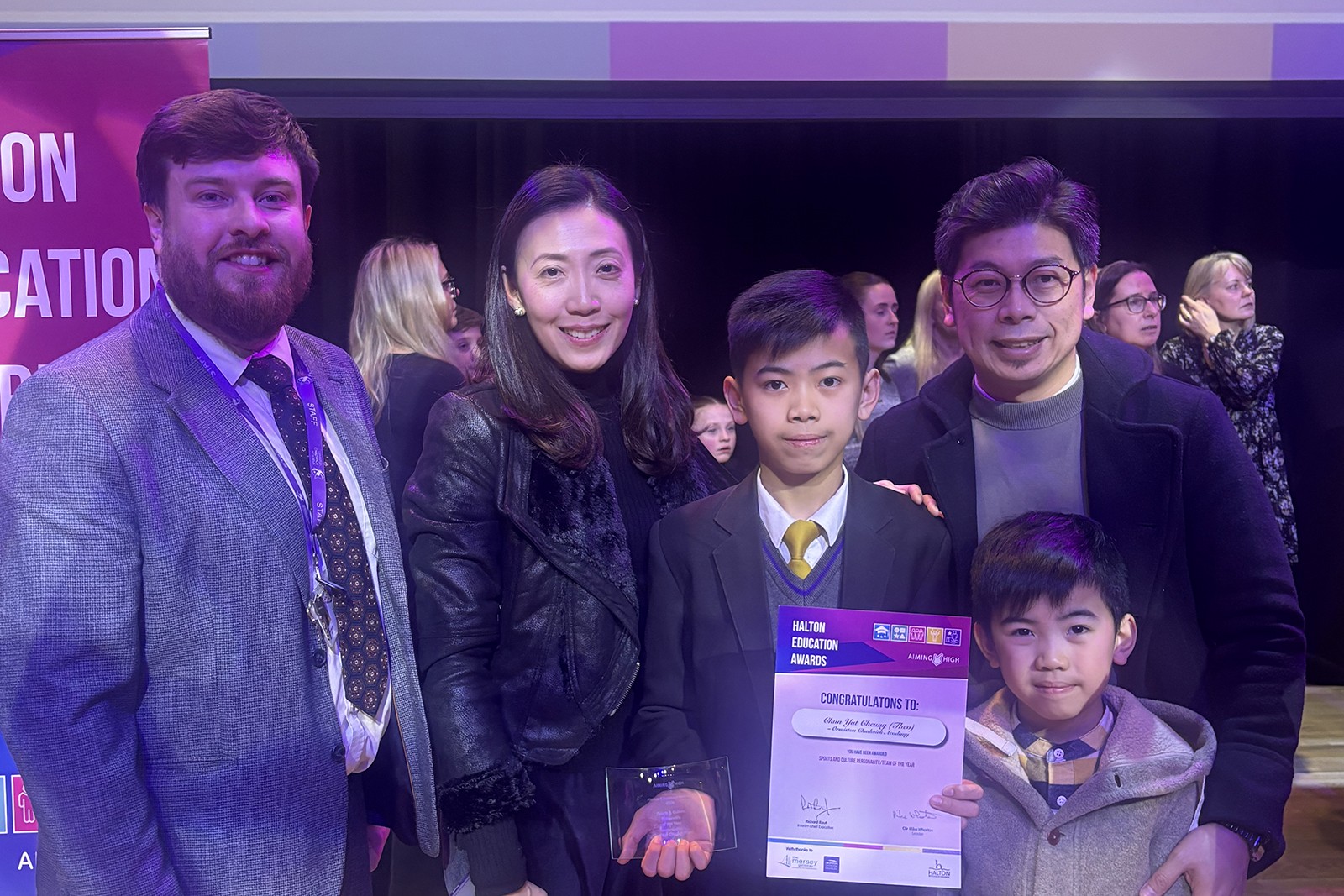Photo of parents and pupil with prize from Ormiston Chadwick Academy